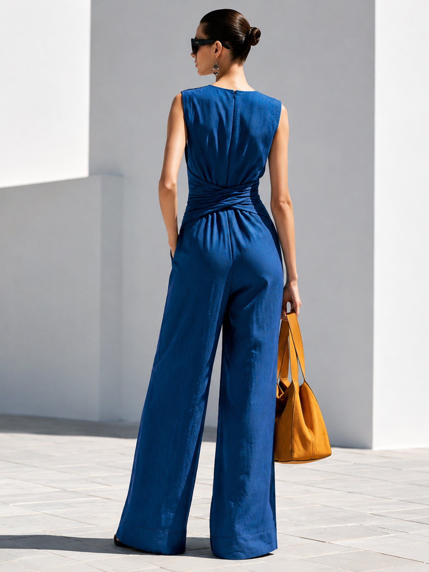 Embroidered Sleeveless Jumpsuit With V-Neck And Waist Twist