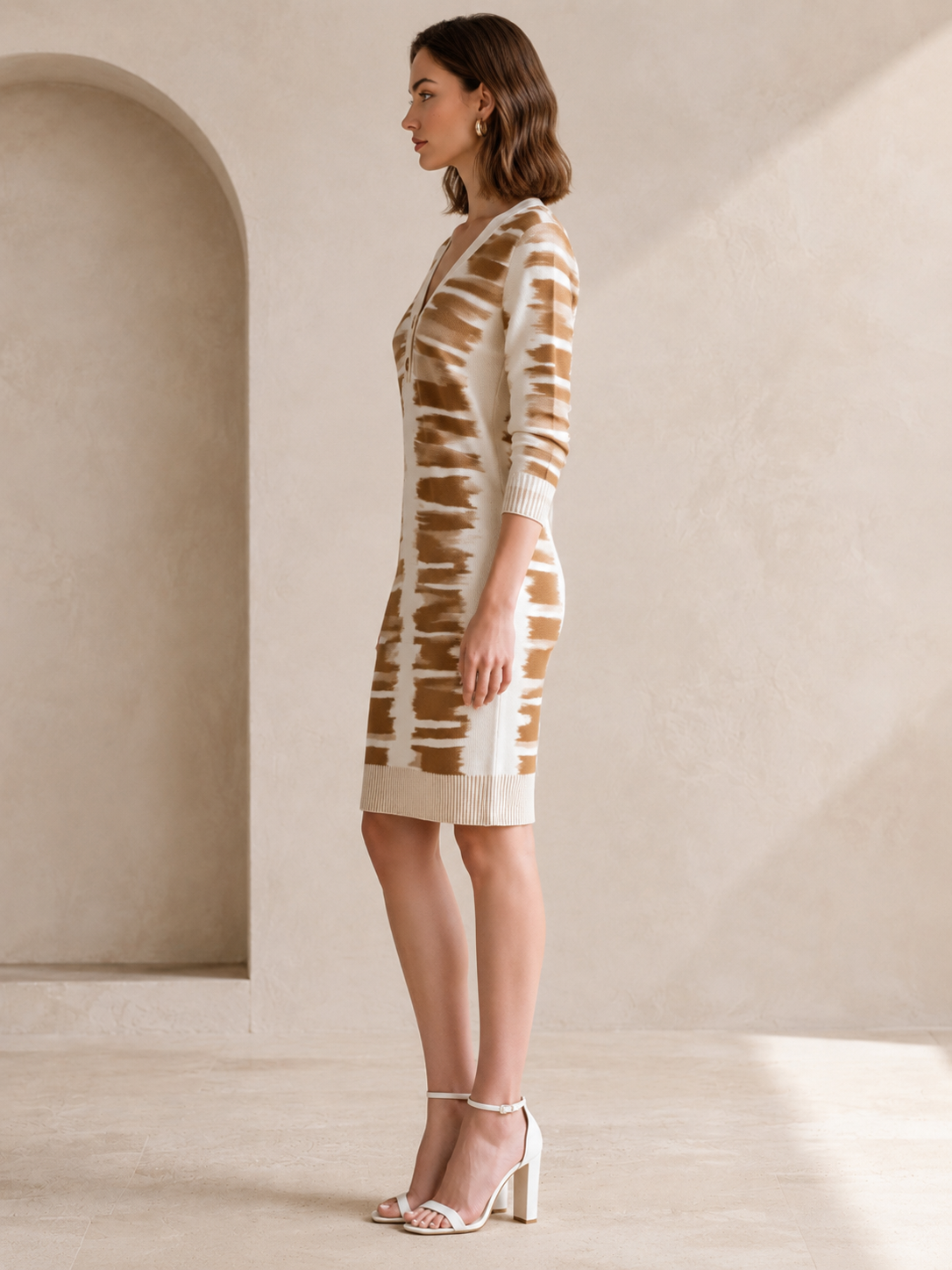 Elegant White Long-sleeved Knit Dress With A Tan Floral Pattern