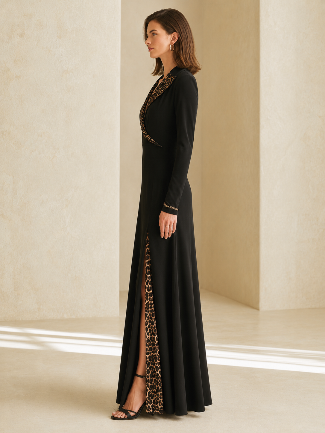 Elegant Black Long-sleeved Maxi Dress With A V-neck And Leopard-print Paneling.