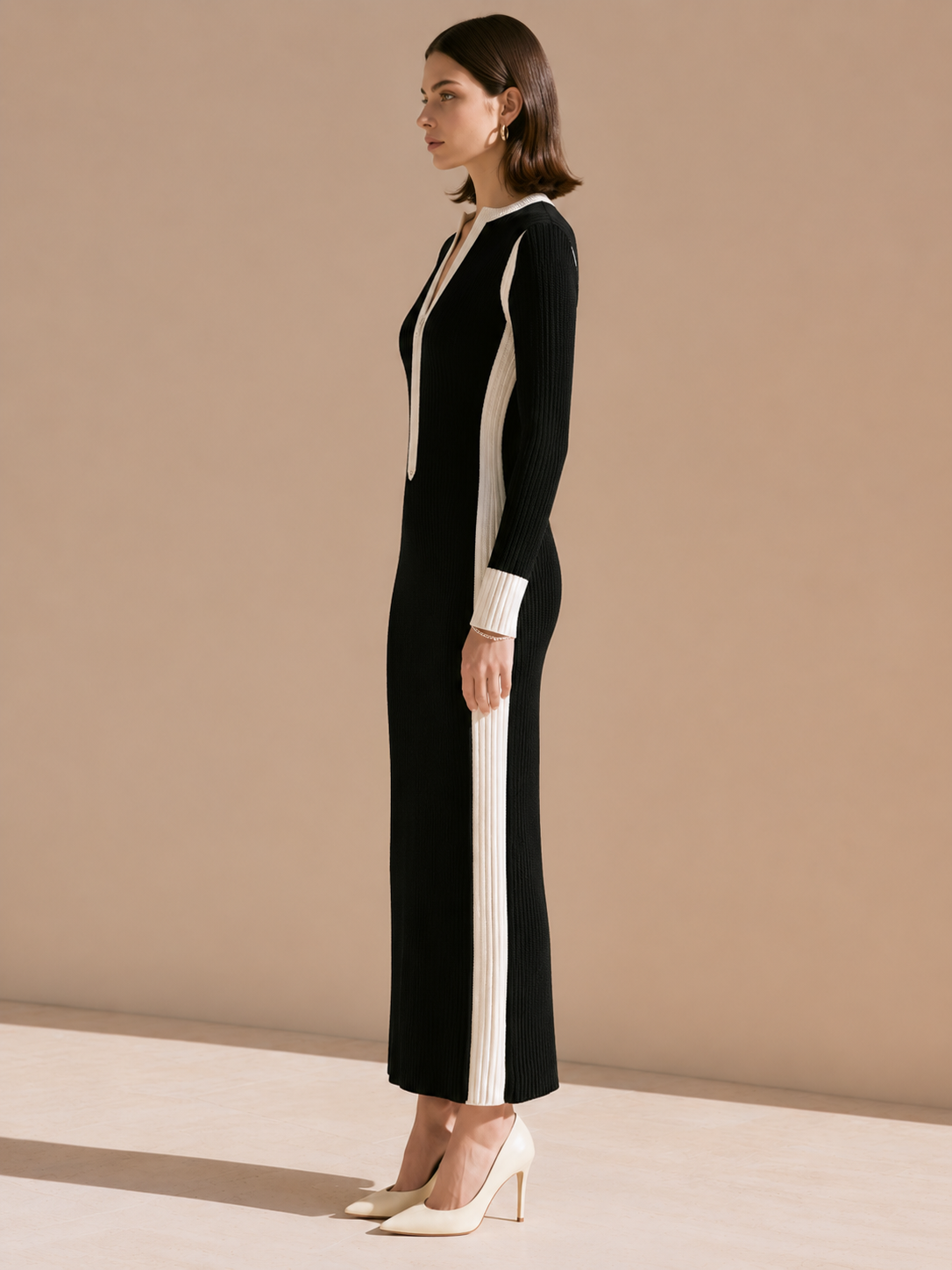 Elegant Black-and-white Striped Knit Dress With Contrasting Colors.
