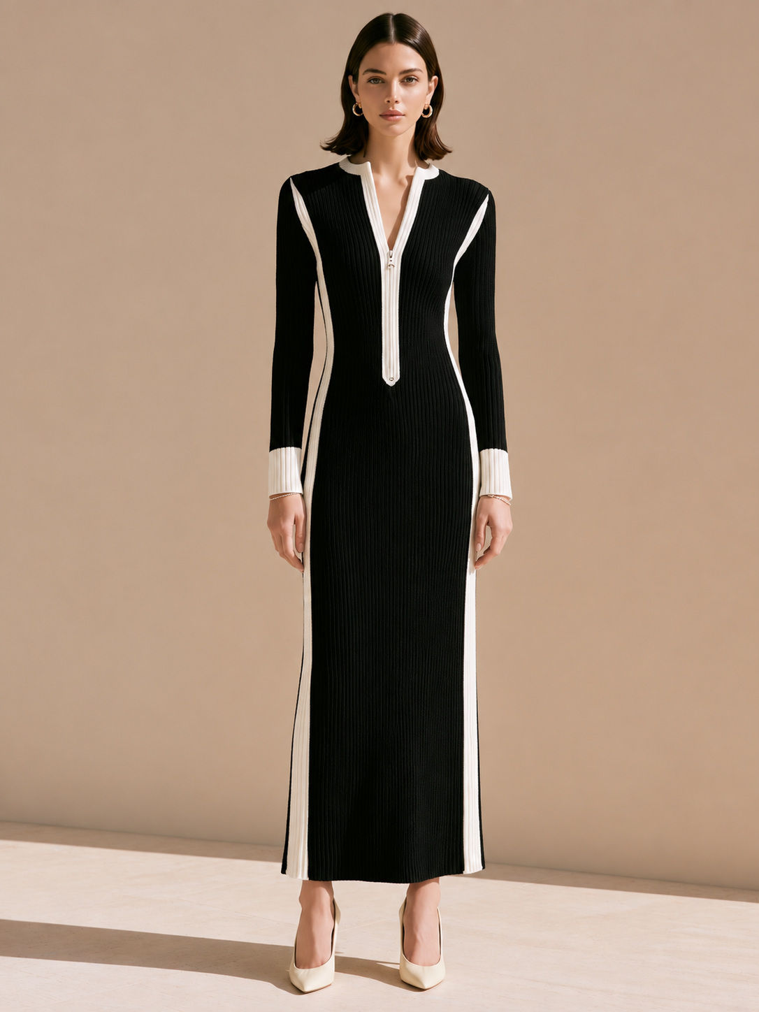 Elegant Black-and-white Striped Knit Dress With Contrasting Colors.