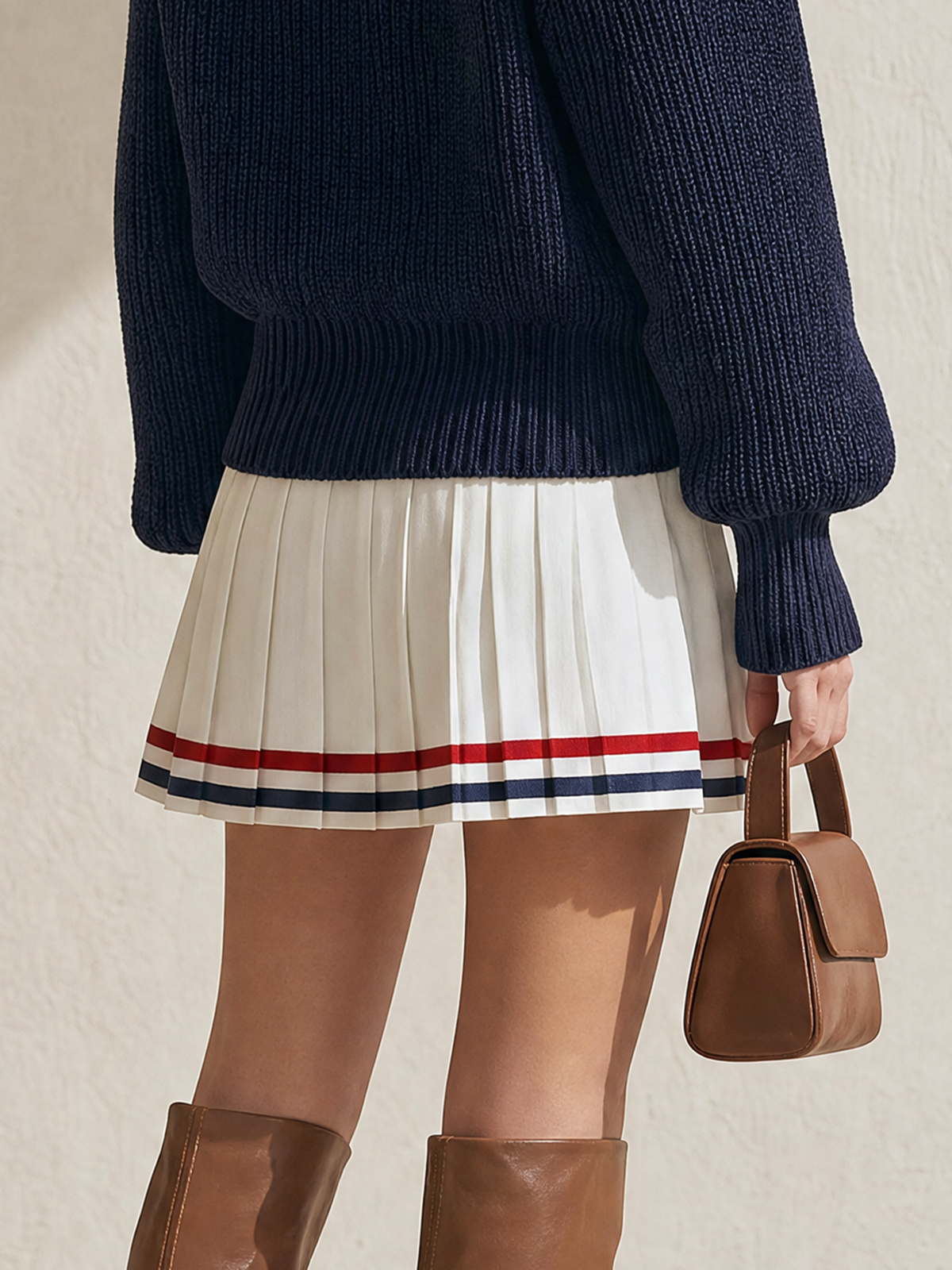Off‑White High‑Waist Pleated Mini Skirt With Contrast Striped Hem