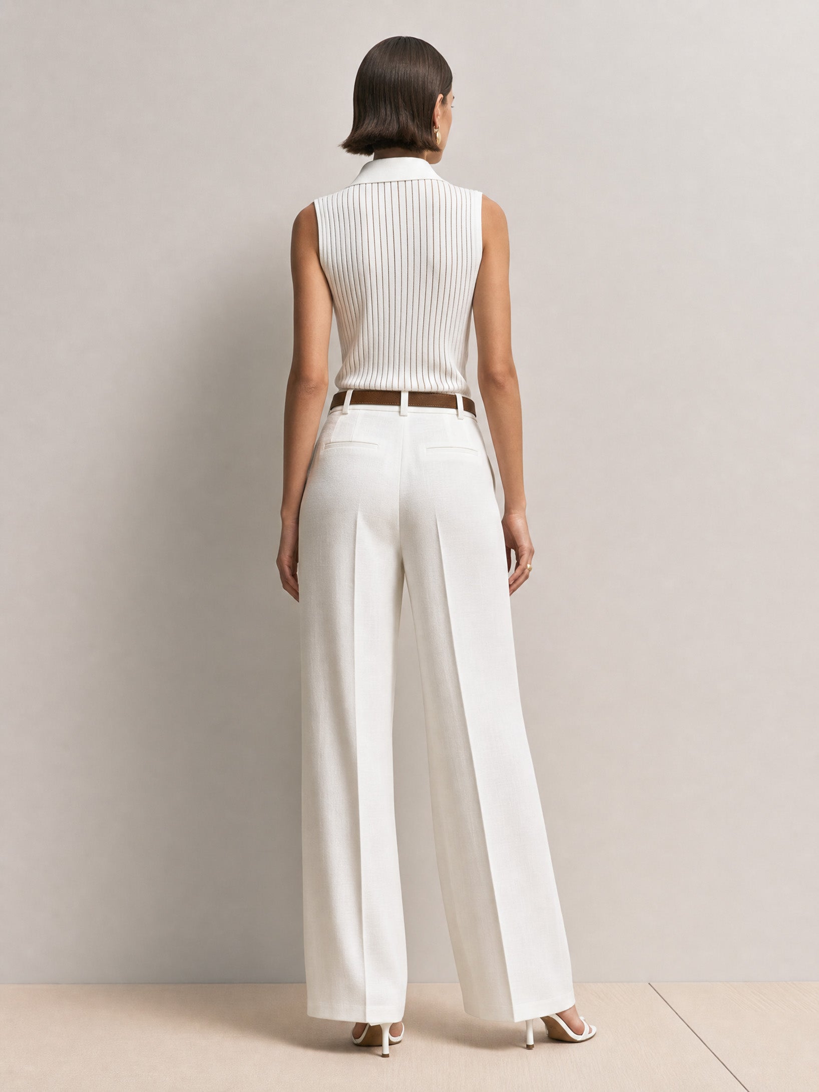 Elegant Ribbed Sleeveless Top & White Straight-leg Wide-leg Trousers.