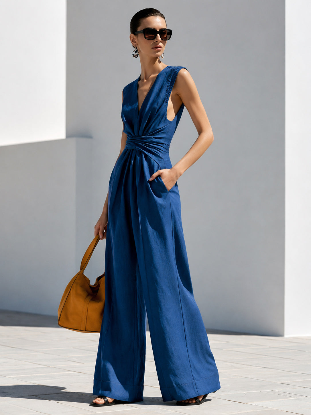 Embroidered Sleeveless Jumpsuit With V-Neck And Waist Twist