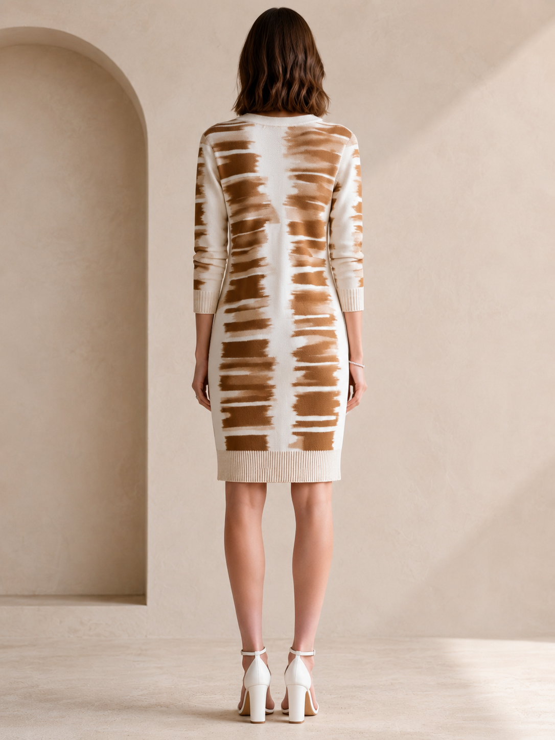 Elegant White Long-sleeved Knit Dress With A Tan Floral Pattern