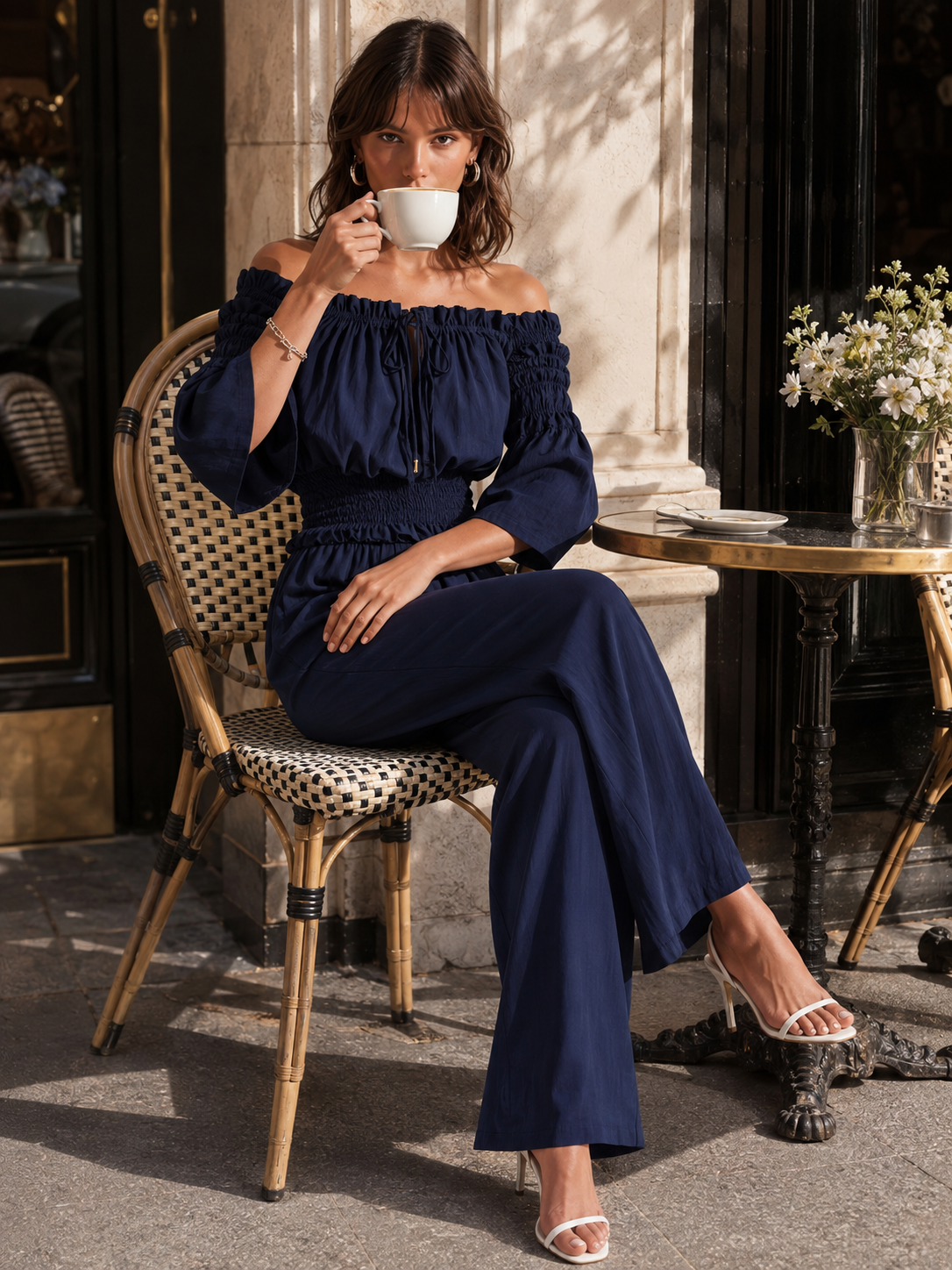Elegant Dark Blue Off-shoulder Jumpsuit With A Drawstring Waist And Smocked Detailing.