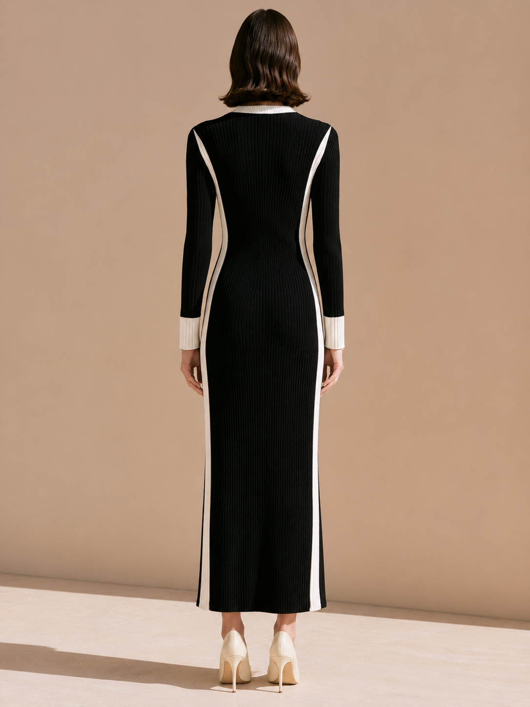Elegant Black-and-white Striped Knit Dress With Contrasting Colors.