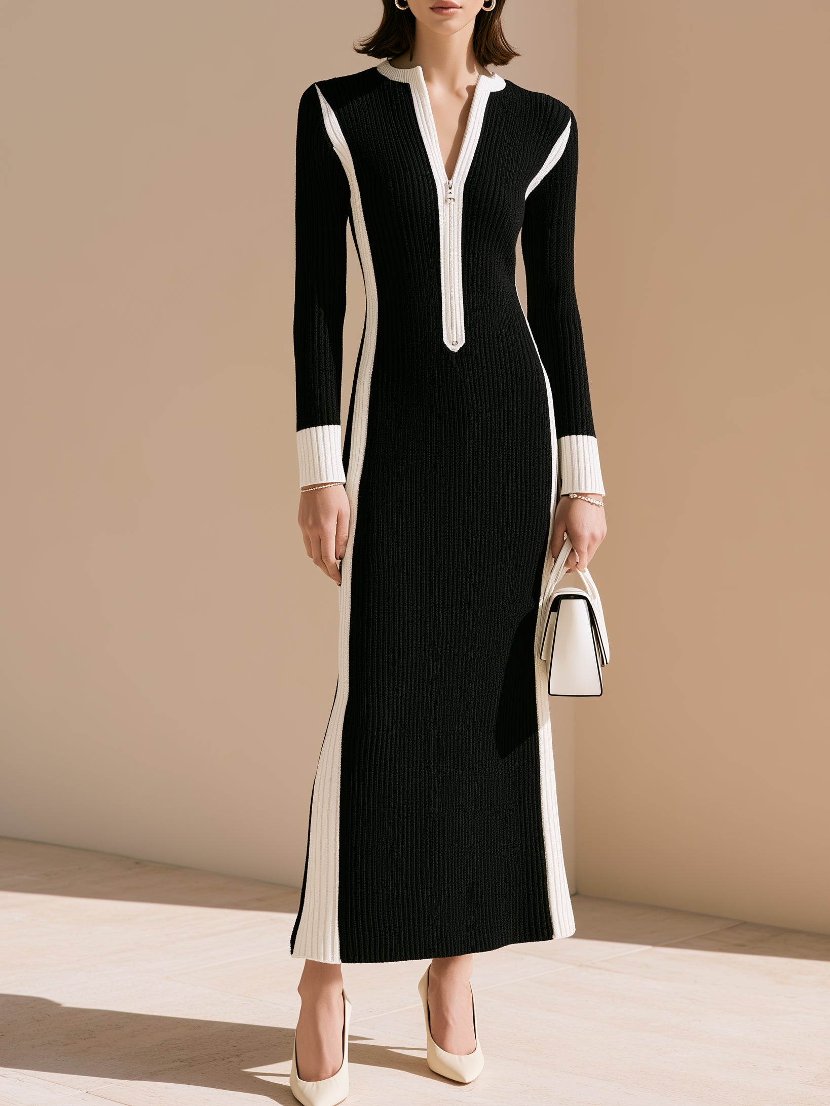 Elegant Black-and-white Striped Knit Dress With Contrasting Colors.