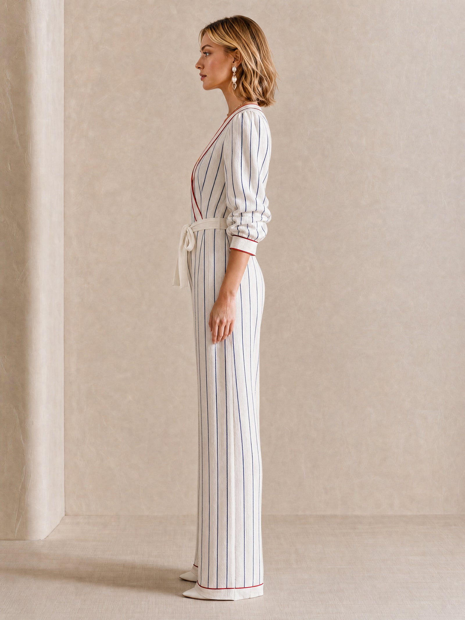 Elegant Off-White Jumpsuit With Contrasting Stripes