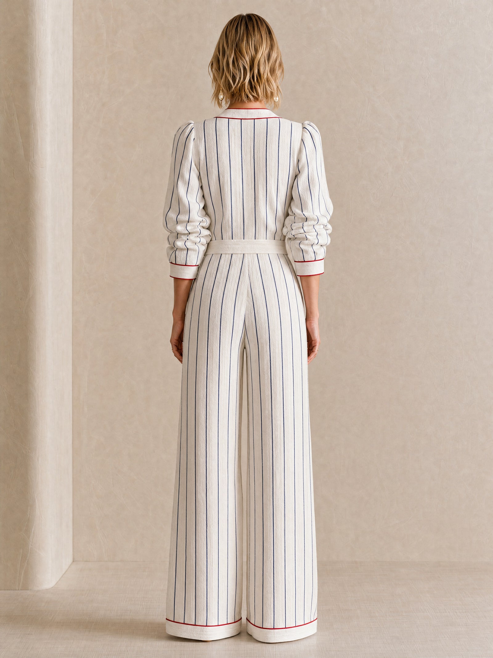 Elegant Off-White Jumpsuit With Contrasting Stripes