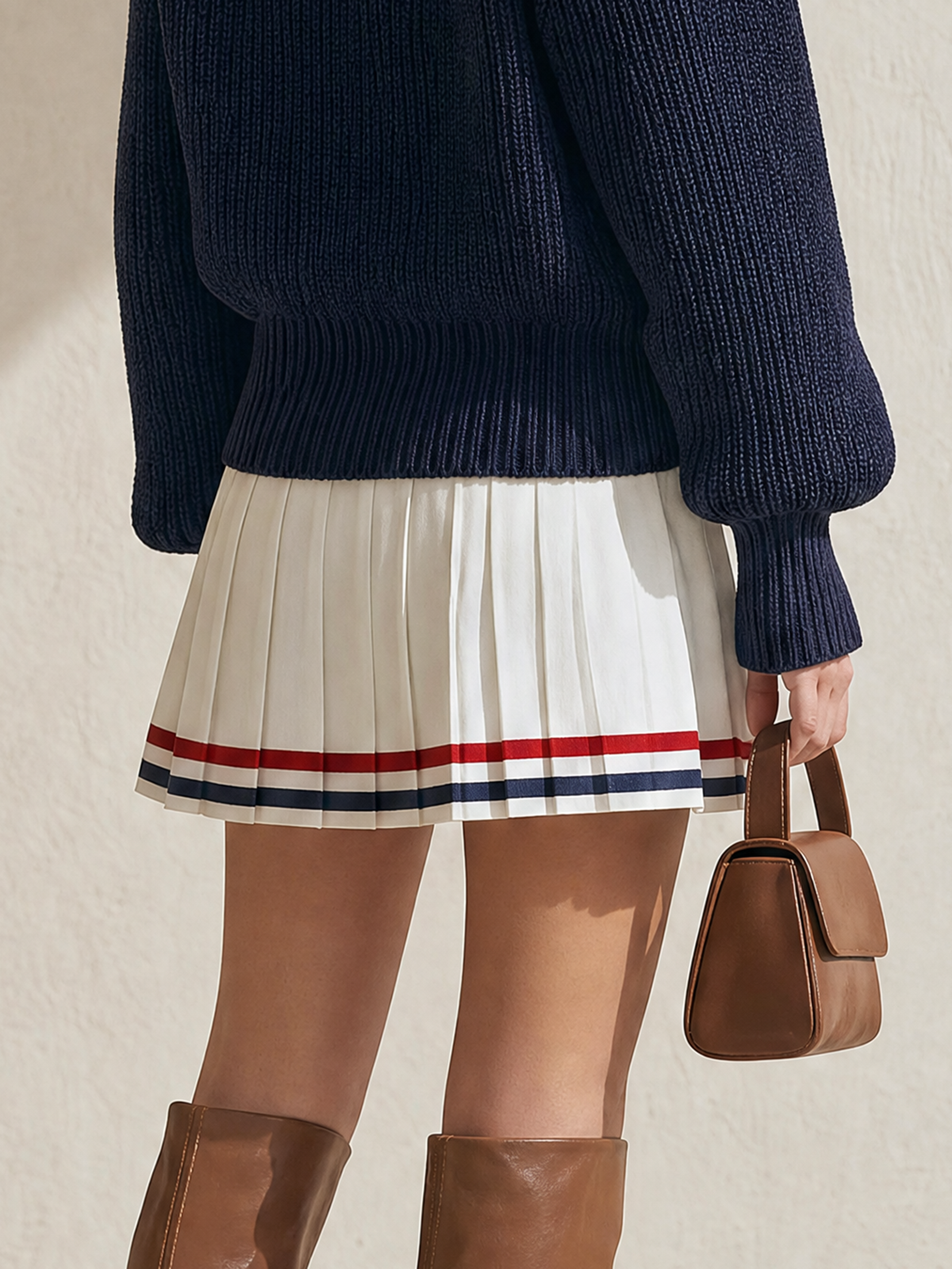 Off‑White High‑Waist Pleated Mini Skirt With Contrast Striped Hem